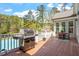 Outdoor deck features a grill and seating near the swimming pool at 1422 Gormly Cir, Sanford, NC 27330