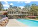 Stunning two-story home with a spacious deck overlooking a private backyard and inviting swimming pool at 1422 Gormly Cir, Sanford, NC 27330
