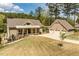 Charming home with a covered front porch, attached garage, and well-maintained lawn at 1422 Gormly Cir, Sanford, NC 27330