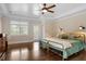 Bedroom with hardwood floors, tray ceiling and views of the yard at 1422 Gormly Cir, Sanford, NC 27330