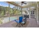 View of a screened porch featuring an outdoor seating area and a scenic view of the backyard pool at 1422 Gormly Cir, Sanford, NC 27330