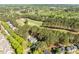 Scenic aerial view of a residential area adjacent to a lush green golf course at 1537 Heritage Club Ave, Wake Forest, NC 27587