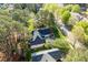 An aerial view of a well-maintained house and backyard with mature trees and neighboring houses at 1537 Heritage Club Ave, Wake Forest, NC 27587