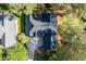 Aerial view of a beautiful house with a dark roof, surrounded by lush trees at 1537 Heritage Club Ave, Wake Forest, NC 27587