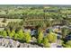 Residential neighborhood with mature trees, well-maintained lawns, and houses of varying styles at 1537 Heritage Club Ave, Wake Forest, NC 27587