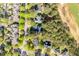 An aerial view of a residential neighborhood with well-maintained homes and lush green trees at 1537 Heritage Club Ave, Wake Forest, NC 27587