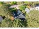 Aerial view of a house with a dark roof, surrounded by trees and other houses at 1537 Heritage Club Ave, Wake Forest, NC 27587