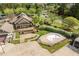 Aerial view of an amenity center with a fenced-in pool and a well-manicured yard at 1537 Heritage Club Ave, Wake Forest, NC 27587