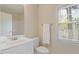 Well-lit bathroom featuring a white vanity, framed mirror and a shower-tub combo at 1537 Heritage Club Ave, Wake Forest, NC 27587