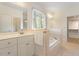 Bright bathroom featuring a soaking tub, double vanity, and a separate walk-in shower at 1537 Heritage Club Ave, Wake Forest, NC 27587
