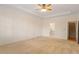 Large bedroom with neutral carpet, a tray ceiling, and access to an ensuite bath at 1537 Heritage Club Ave, Wake Forest, NC 27587
