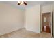 Cozy bedroom with neutral paint and view into a hallway at 1537 Heritage Club Ave, Wake Forest, NC 27587