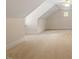 Large bonus room with neutral carpet, sloped ceilings, and a small window at 1537 Heritage Club Ave, Wake Forest, NC 27587