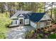 Attractive single-story home with a stone facade, well-kept landscaping, and a driveway at 1537 Heritage Club Ave, Wake Forest, NC 27587