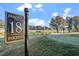 Scenic view of the 18th hole at Heritage Golf Club with the club's signage at 1537 Heritage Club Ave, Wake Forest, NC 27587
