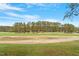Well-manicured golf course landscape featuring beautiful green grass and mature trees at 1537 Heritage Club Ave, Wake Forest, NC 27587