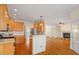 Kitchen with stainless appliances, and view to the fireplace in the living room at 1537 Heritage Club Ave, Wake Forest, NC 27587