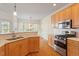 Kitchen with stainless appliances, gas range, and view to eat-in breakfast area at 1537 Heritage Club Ave, Wake Forest, NC 27587