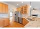 Bright kitchen with stainless steel appliances and granite countertops at 1537 Heritage Club Ave, Wake Forest, NC 27587