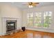 Inviting living room with fireplace, hardwood floors, and natural light at 1537 Heritage Club Ave, Wake Forest, NC 27587