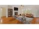 Cozy living room with fireplace, built-in shelving, and large windows that bring in natural light at 1537 Heritage Club Ave, Wake Forest, NC 27587