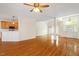 Open-concept living area with hardwood floors, light paint, and access to the kitchen at 1537 Heritage Club Ave, Wake Forest, NC 27587