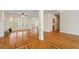 Bright and airy living room with hardwood floors and large windows at 1537 Heritage Club Ave, Wake Forest, NC 27587