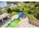 Up-close view of the blue pool slide featuring black stairs and safety features at 1537 Heritage Club Ave, Wake Forest, NC 27587