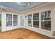 A charming sunroom with a wood deck, large windows, and an exterior access door at 1537 Heritage Club Ave, Wake Forest, NC 27587