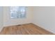 Bright room with hardwood floors and a sunlit window, offering a cozy atmosphere at 157 Durants Neck Ln, Morrisville, NC 27560