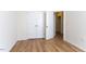 Bedroom with wood-look flooring and an open closet providing a welcoming atmosphere at 157 Durants Neck Ln, Morrisville, NC 27560