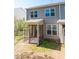 Back exterior of home with screened in porch overlooking yard at 157 Durants Neck Ln, Morrisville, NC 27560