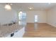 Open kitchen featuring an island, granite counters, stainless steel appliances, and a dining area at 157 Durants Neck Ln, Morrisville, NC 27560