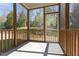 Covered porch with wood support beams and railing for outdoor enjoyment at 157 Durants Neck Ln, Morrisville, NC 27560