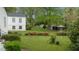 Sprawling backyard with colorful flower beds and lush landscaping, offering a serene outdoor space at 1631 Sunset Ave, Henderson, NC 27536