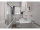 Cozy bathroom featuring a tub/shower combination and vanity with storage at 1631 Sunset Ave, Henderson, NC 27536