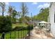 Outdoor deck with dining table and chairs providing a relaxing space with a beautiful view at 1631 Sunset Ave, Henderson, NC 27536
