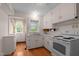 Classic white kitchen featuring ample cabinet space and a vintage stove at 1631 Sunset Ave, Henderson, NC 27536