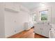 Charming kitchen with wood floors and white cabinets, featuring a double sink at 1631 Sunset Ave, Henderson, NC 27536