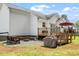 This backyard features a nice deck, table and barbecue at 1752 Cobblestone Dr, Creedmoor, NC 27522