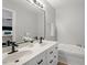 This bathroom features double sinks, vanity and a stand alone bathtub at 1752 Cobblestone Dr, Creedmoor, NC 27522