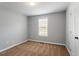 Cozy bedroom with neutral carpet and a window overlooking the yard at 1752 Cobblestone Dr, Creedmoor, NC 27522