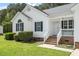 Inviting front porch and manicured lawn enhance this single-story home's curb appeal at 1752 Cobblestone Dr, Creedmoor, NC 27522