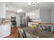 Charming eat-in kitchen with white cabinets and stainless steel appliances at 1752 Cobblestone Dr, Creedmoor, NC 27522