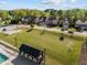 A scenic aerial view of a well-kept neighborhood, featuring a community park, lush green lawns, and attractive homes at 1840 Flint Valley Ln, Apex, NC 27502