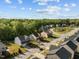 Aerial view of a residential neighborhood showcasing manicured lawns, mature trees, and well-maintained homes at 1840 Flint Valley Ln, Apex, NC 27502