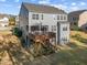 Exterior view of home featuring a wooden deck and screened-in porch overlooking the backyard at 1840 Flint Valley Ln, Apex, NC 27502