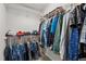 Well-organized walk-in closet with ample storage space, hanging rods, and shelving for efficient clothing storage at 1840 Flint Valley Ln, Apex, NC 27502