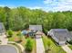 Beautiful home with well-kept front lawn and backyard featuring a private in-ground swimming pool and surrounding trees at 190 Bingham Creek Dr, Garner, NC 27529