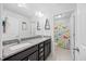 Bright bathroom with granite countertops, dual sinks, and a shower at 190 Bingham Creek Dr, Garner, NC 27529